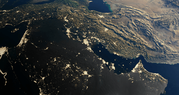 Nighttime satellite view of the Middle East and surrounding regions with visible urban light patterns.